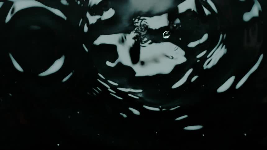Water ripples expand outward as water drops