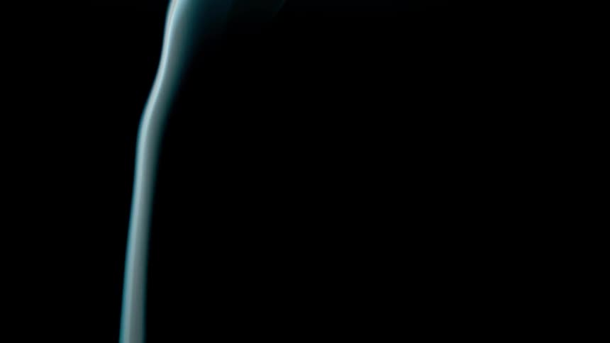 Smoke drifts and swirls in abstract
