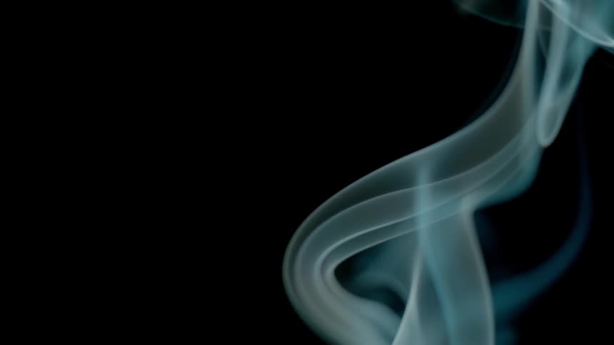 Blue white smoke in a dark room