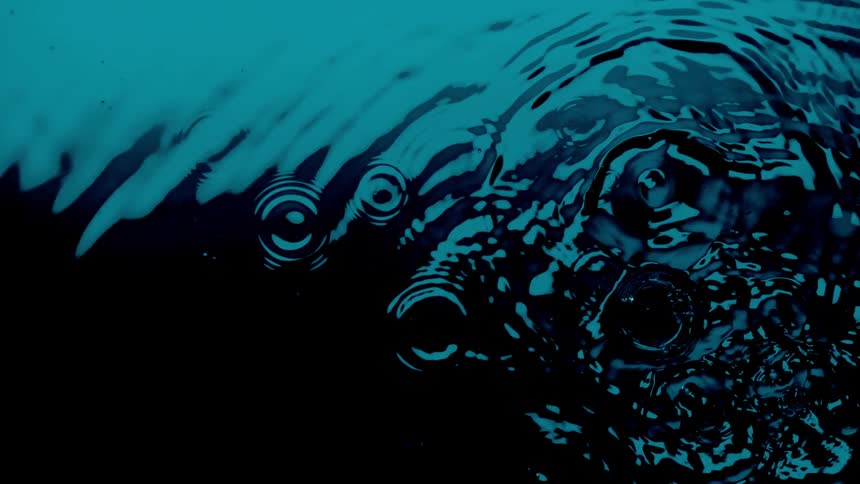 Water ripples expand outward as water drops
