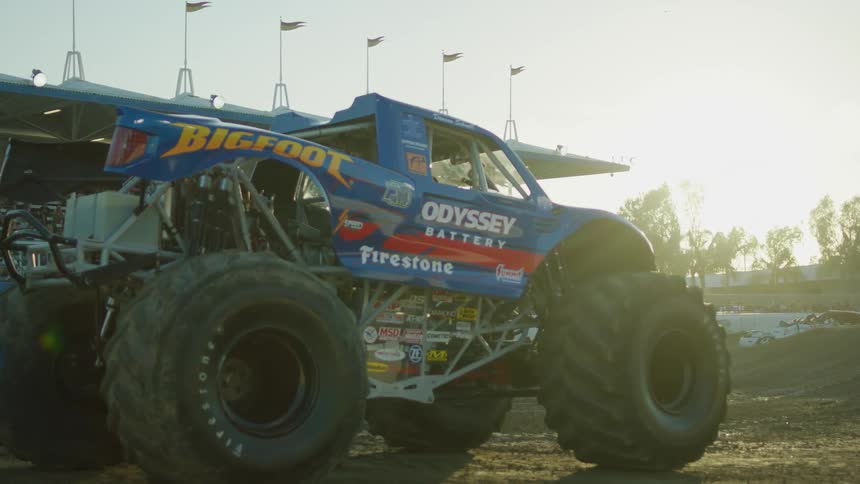 Monster truck backs up at a demolition derby
