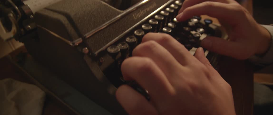 A person using a typewriter