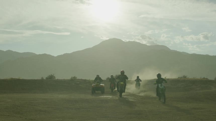 A group of people ride on off road vehicle