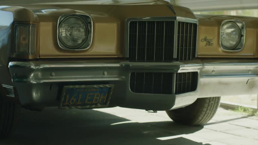 A large car is bronze in color