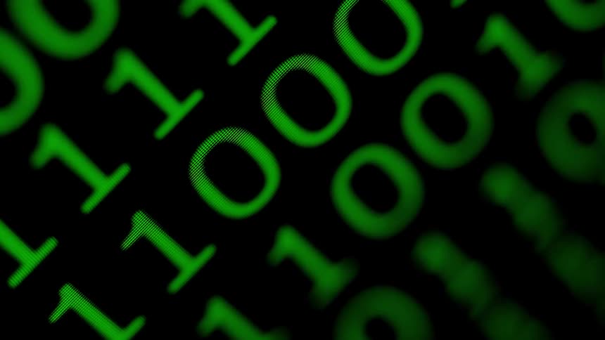 Binary code is displayed on a screen