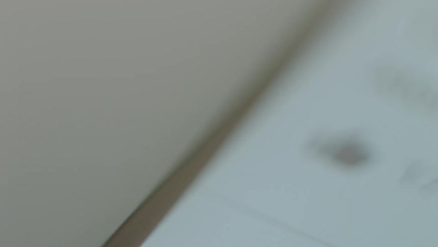 A thin steel bevel is around a white object