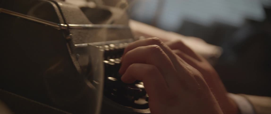 A person using a typewriter