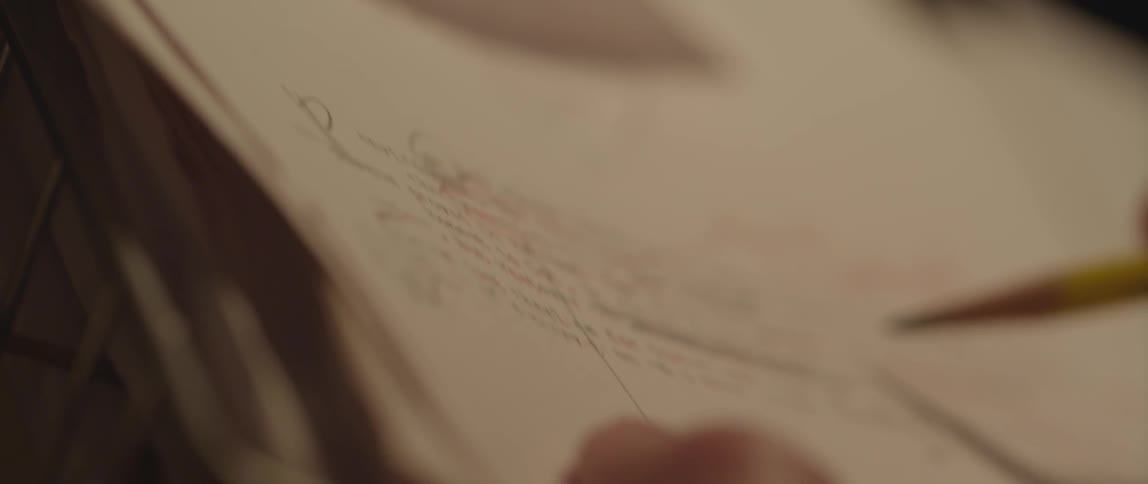 A person writing on paper