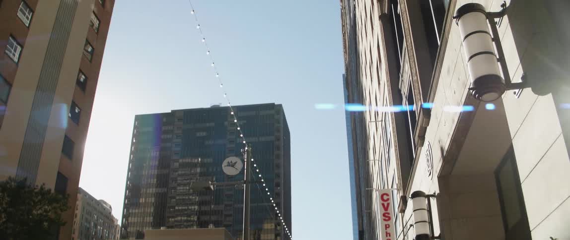 A city skyline being viewed from street level