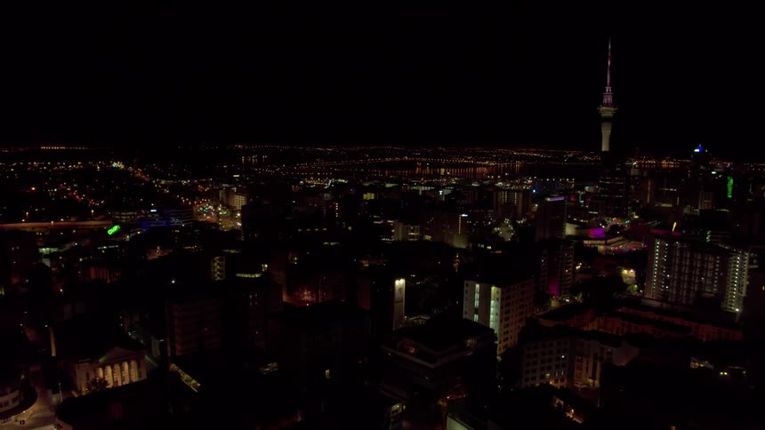 A big city is filmed from a drone at night