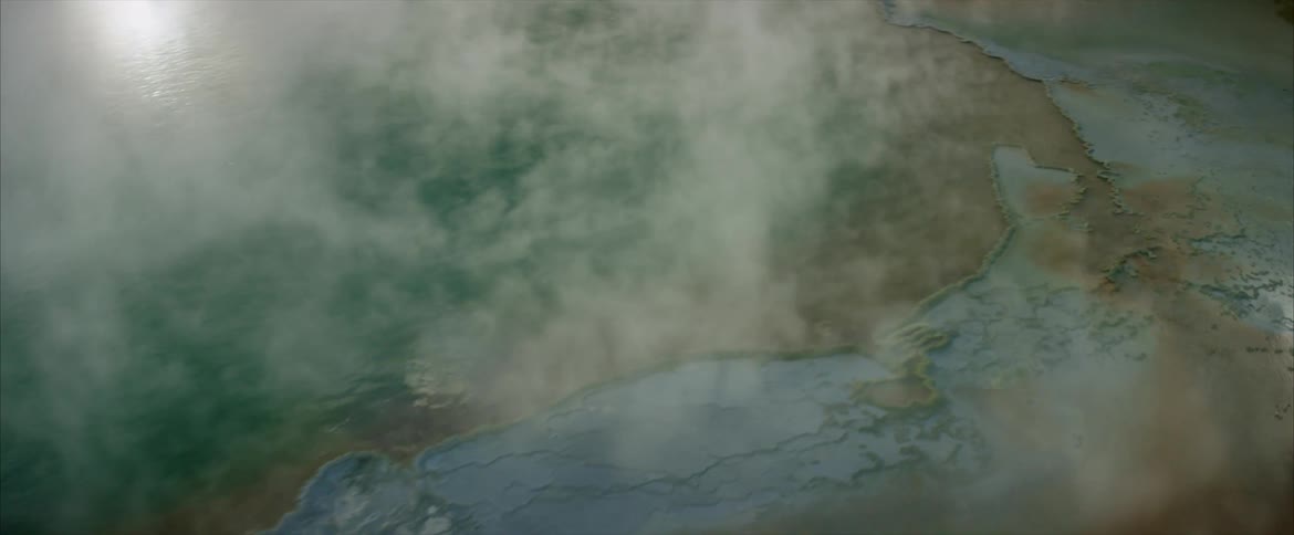 Fog is rolling over the field below