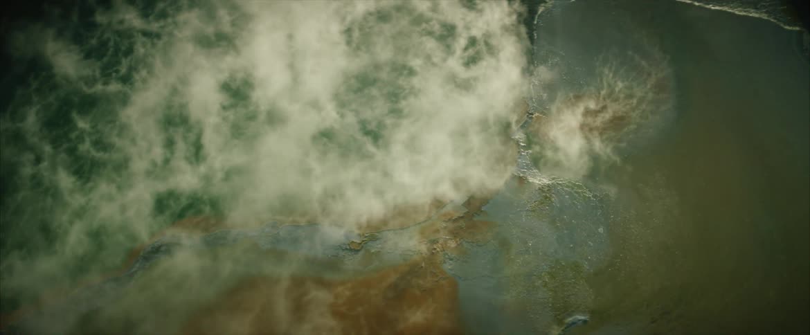 Mist hangs in the air above an estuary at dawn