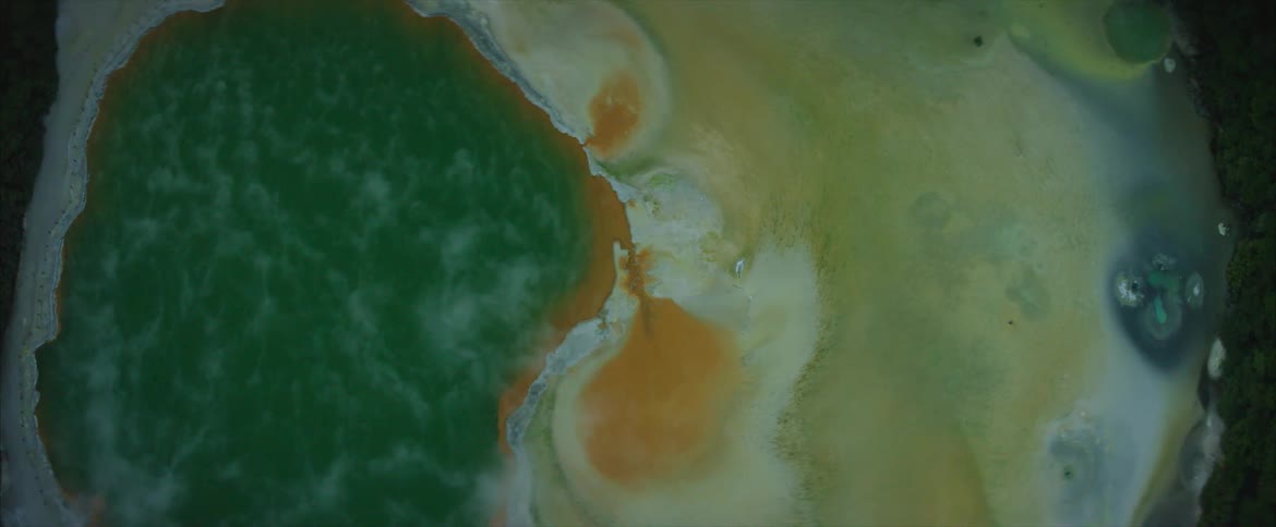 The water is rushing along the coast below