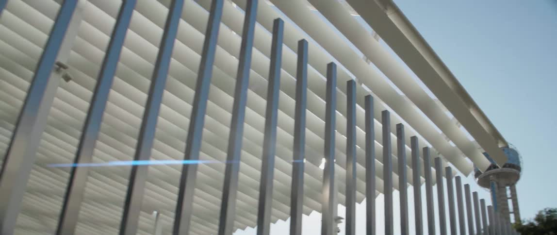 Sunlight filters through an open air enclosure