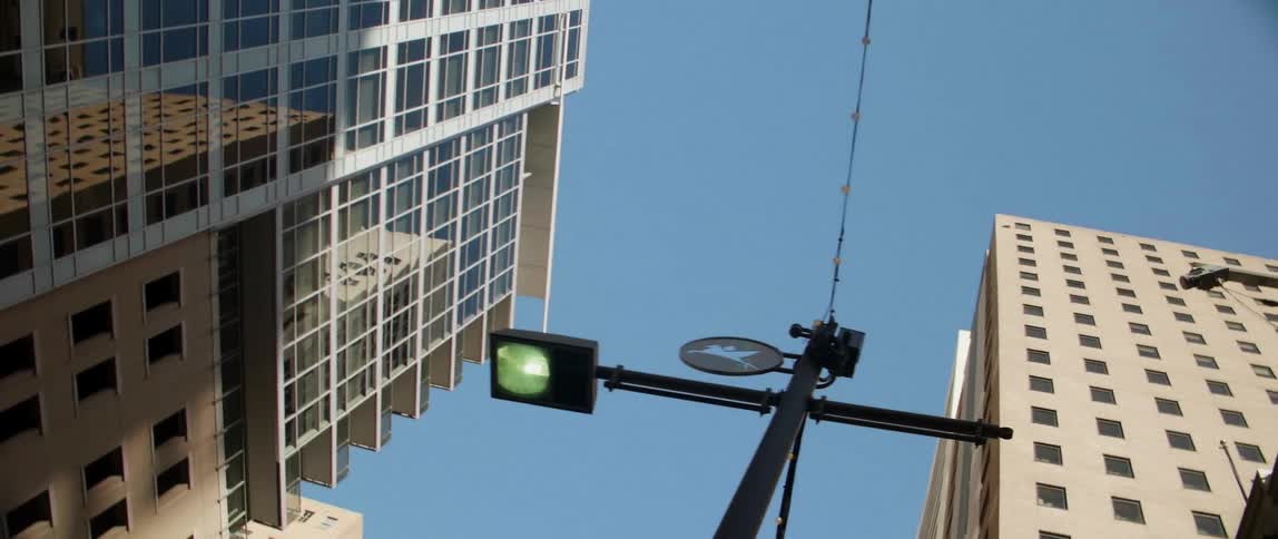 Street light in between buildings in city