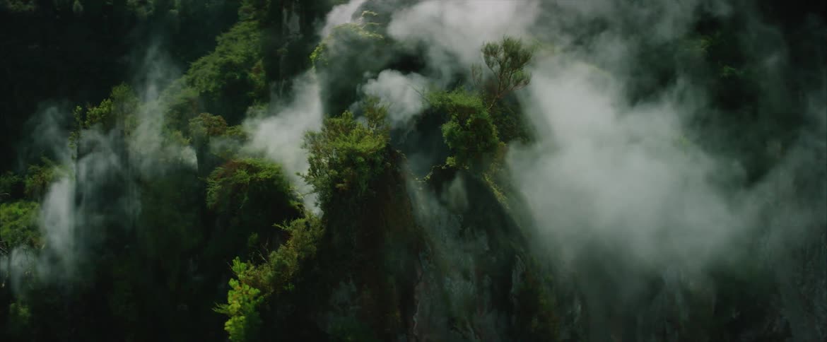 Steam pours from a rock formation
