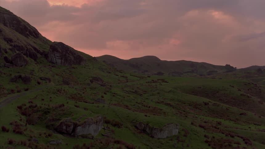 A trail through grassy hills