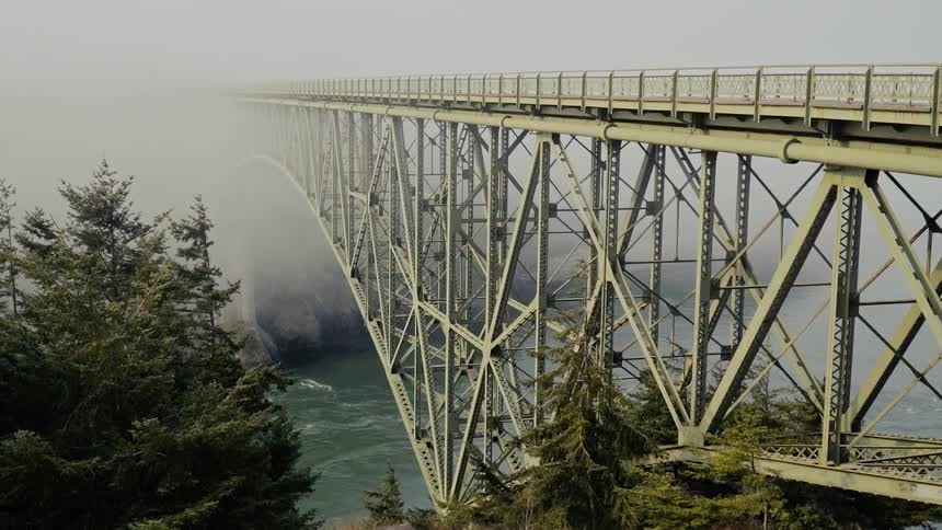 The bridge is completely engulfed in fog