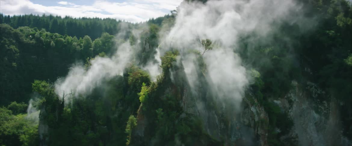 Steam pours from the top of a cliff