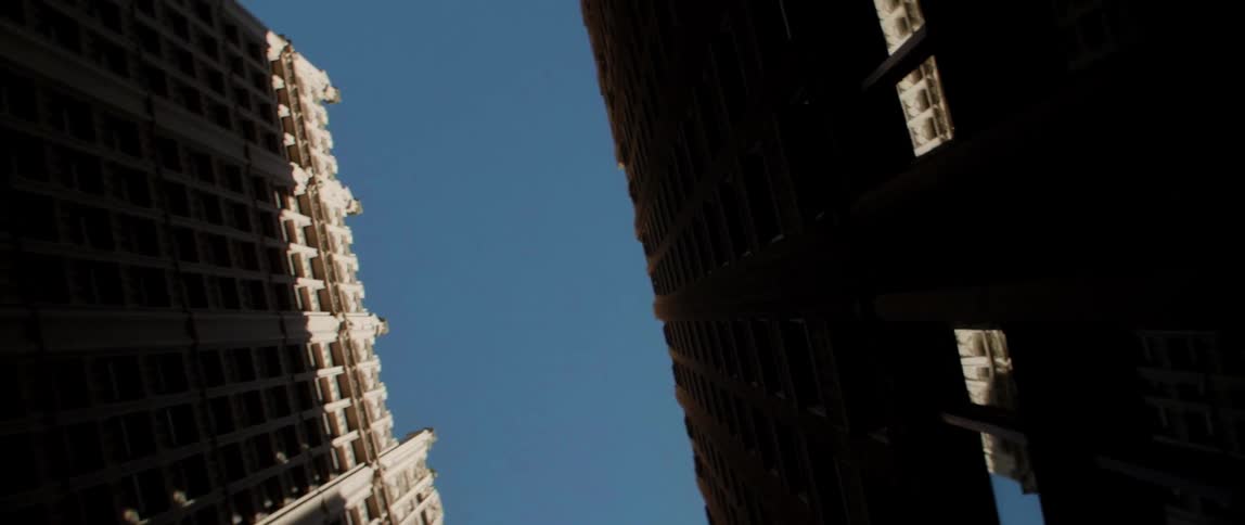 Tall city buildings tower into the sky