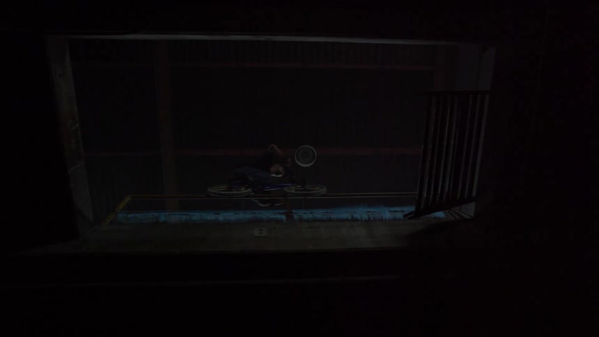 A bmx rider jumps over a puddle an grinds on a railing