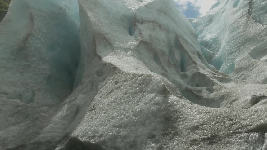 Dirty snow covers a mountainside