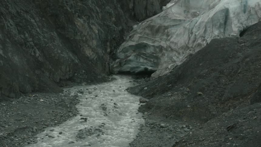 The small stream runs from the melting ice on the mountain