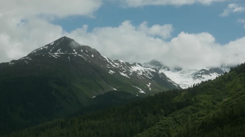 The long mountain range has snow at its peak