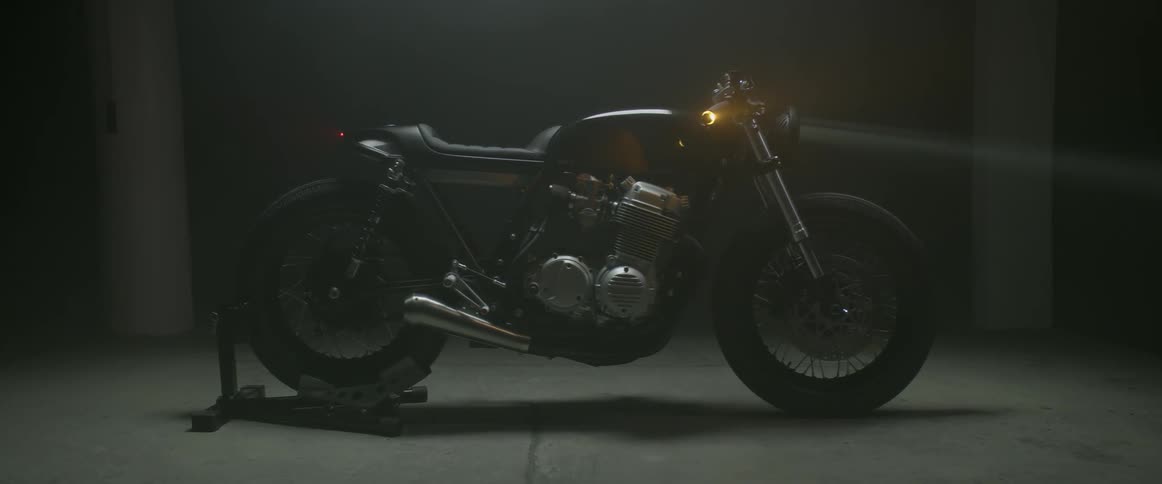 Motorcycle parked indoors at night