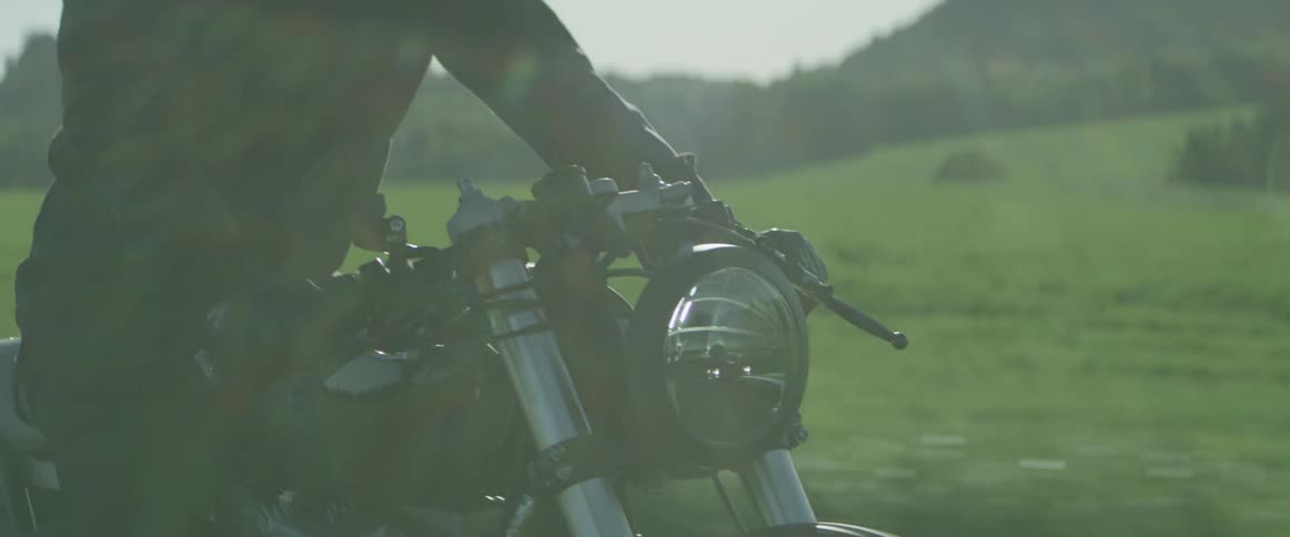 A motorcycle travels down the road