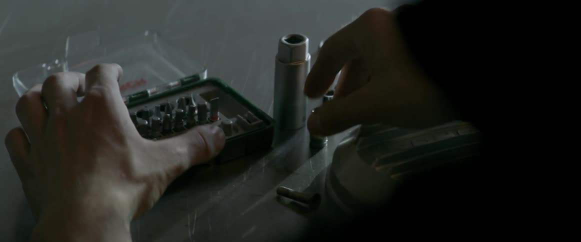A person pulls out tool pieces