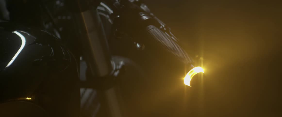 Light turning on at end of handlebar on motorcycle in the dark