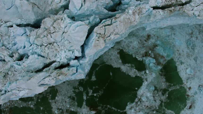 A large shelf of ice is filmed from a drone