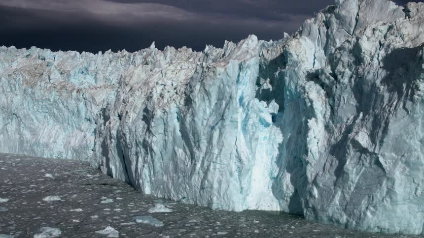 The ice wall is long and blue in color