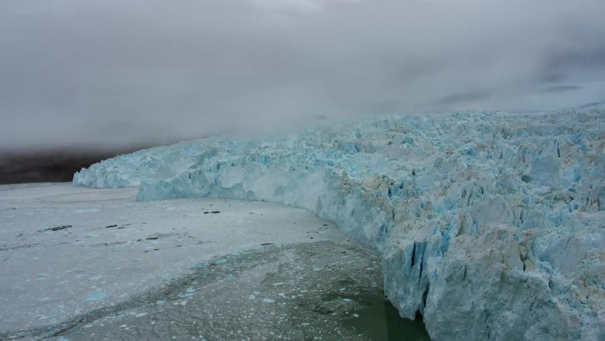 Clouds hover over ice and snow in the wilderness