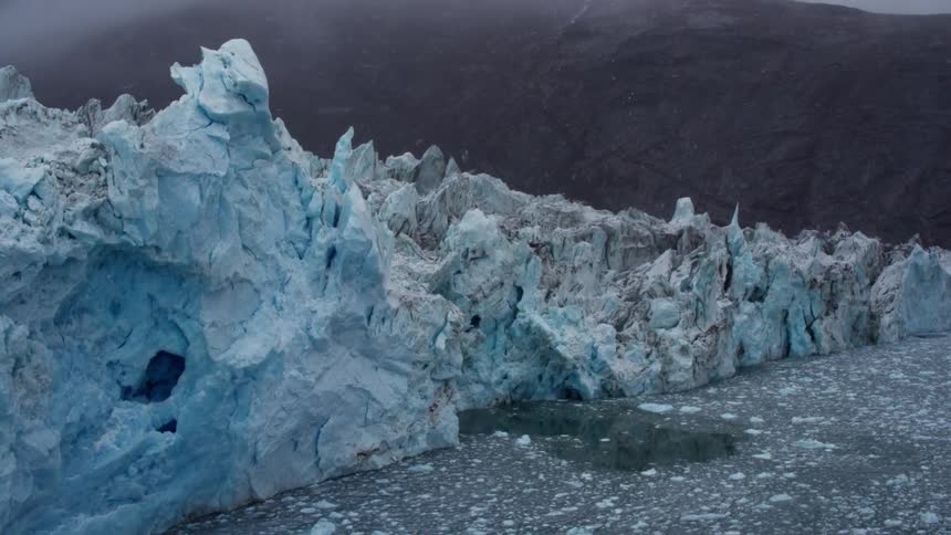 A stretch of blue ice dusted with snow