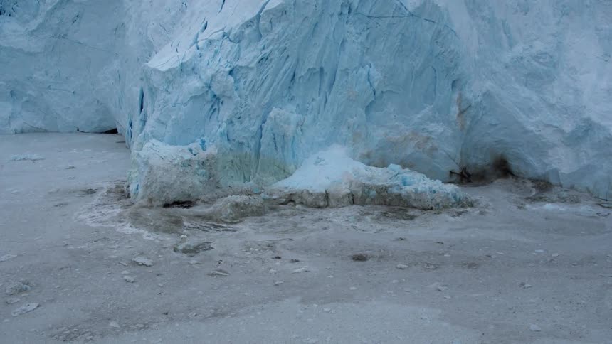 Ice flows into the side of an iceberg