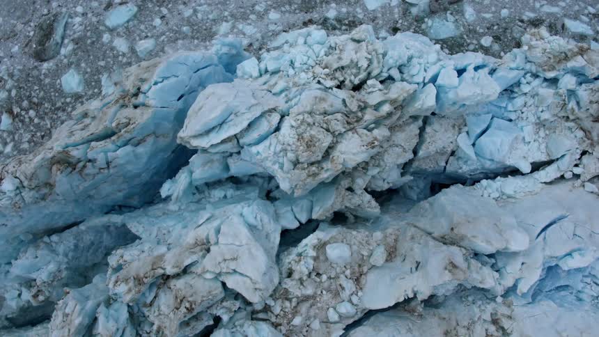 Blue jagged rocks sit on a surface