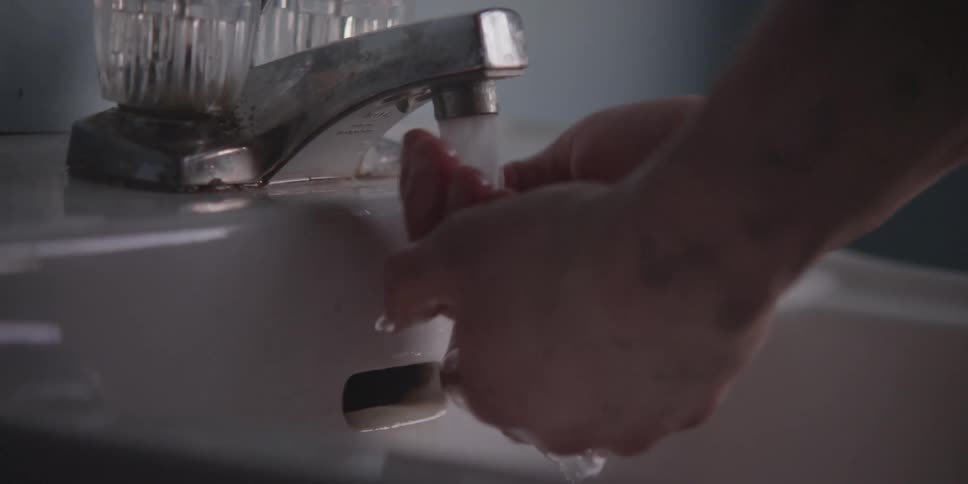 A person washing their hands