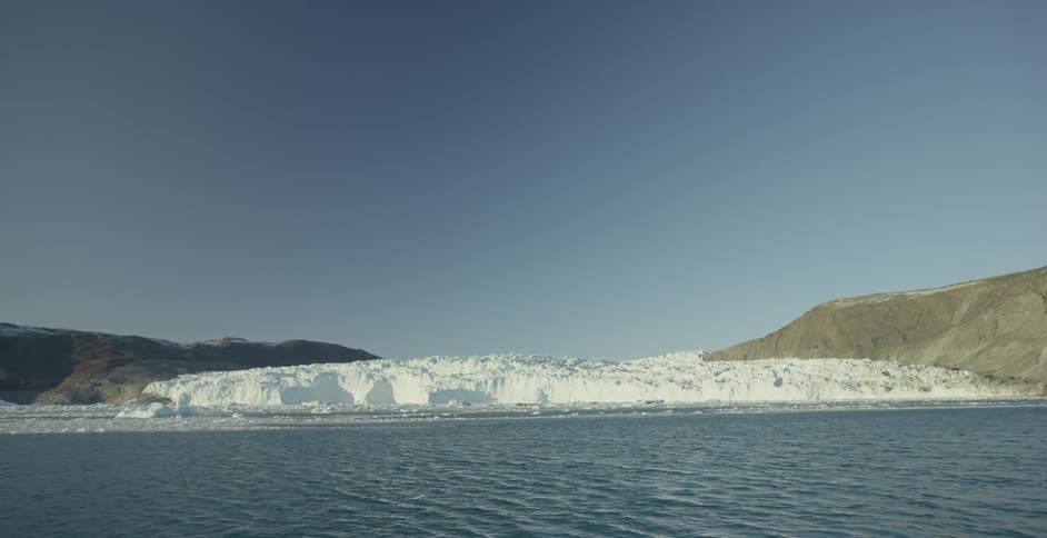 Water flowing in front of an island of snow