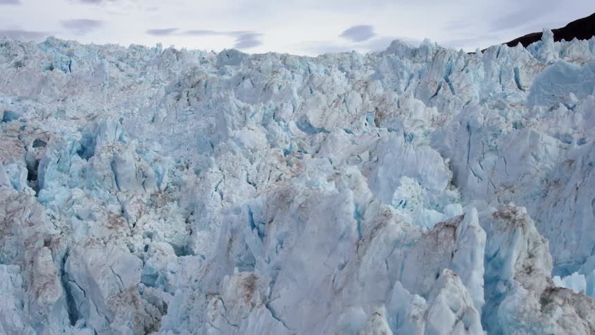 The long ice wall has many jagged edges