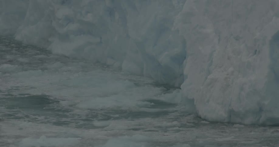 The iceberg is melting giving off small waves