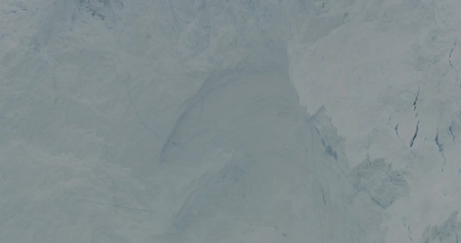 A wall of ice is shown collapsing
