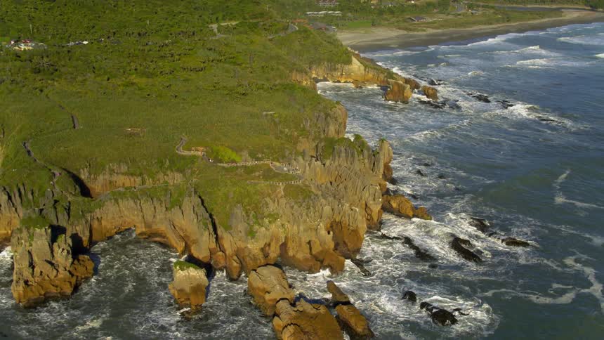 Waves crashing on a rocky hill