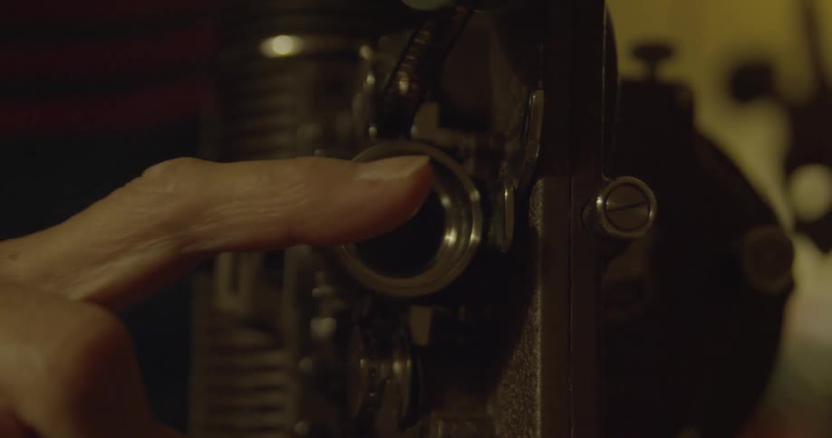 View of the front of a metal device as someone puts their hand over it