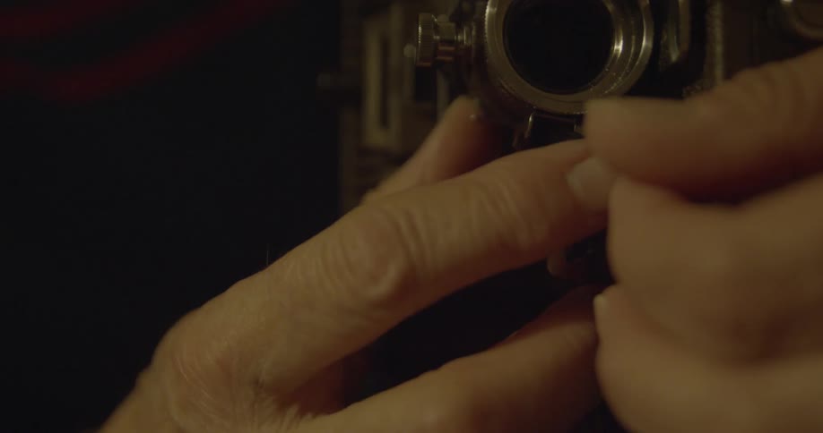 Person adjusting a piece of machinery