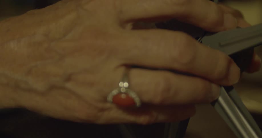 A woman is preparing to watch a movie