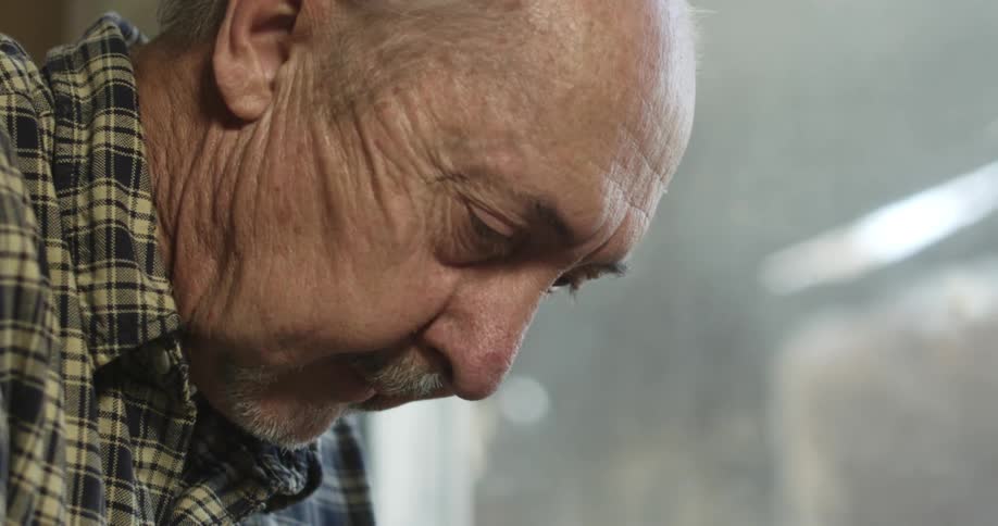 An old man looking down
