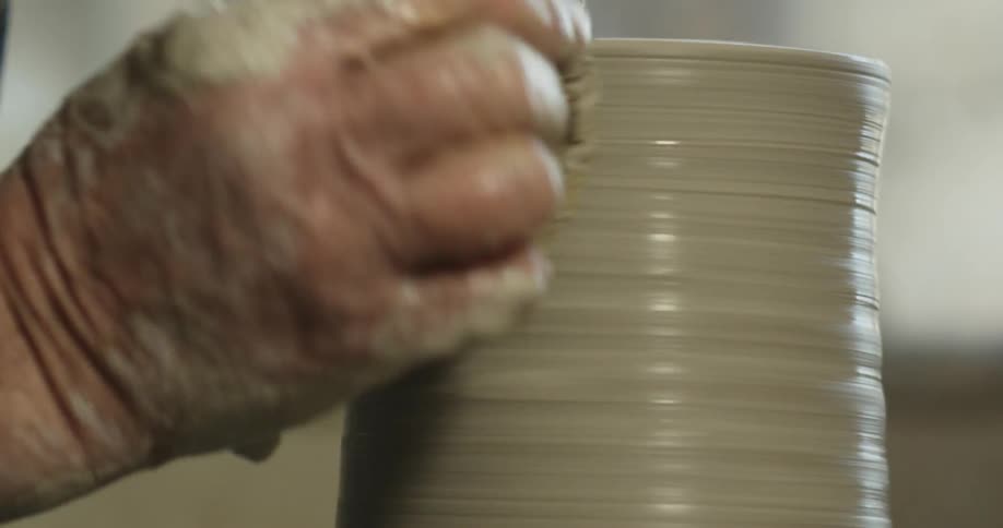 A person is building clay