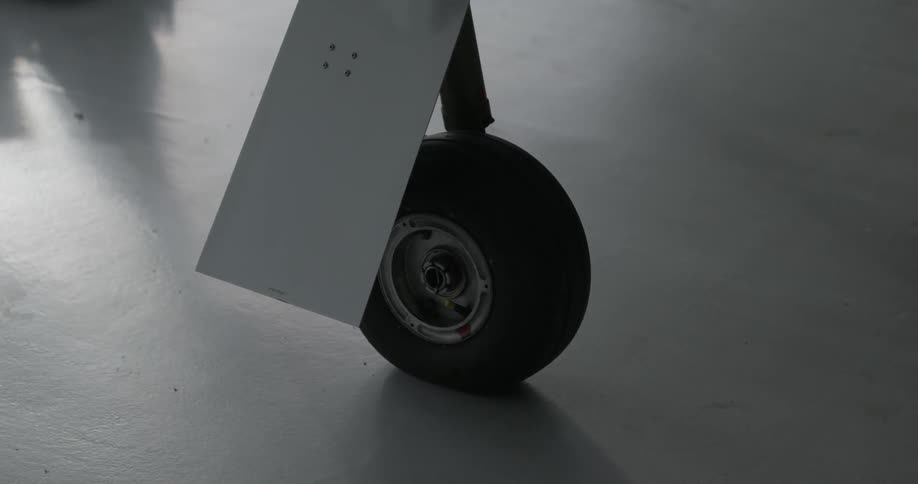 A plane landing gear is shown close up